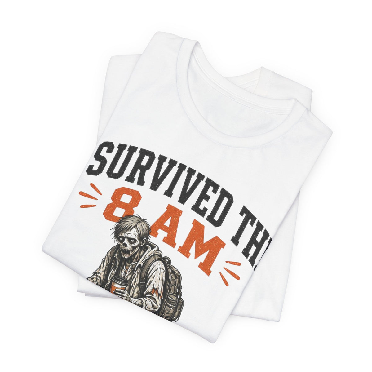 White T-shirt folded stack, bold "Survived the 8 AM" graphic on front
