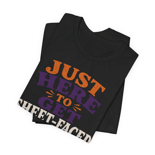 Black crew-neck tee, folded, with "Just Here to Get Sheet-Faced" ghost front graphic
