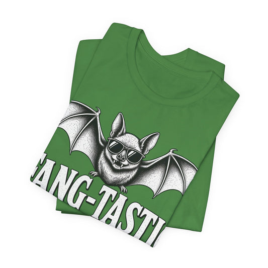 Leaf green graphic tee, folded, showing silver bat with 'FANG-TASTIC' text across front