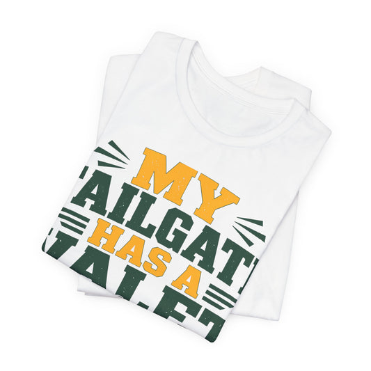 Folded white tee with diagonal "My Tailgate Has a Valet" green/orange print