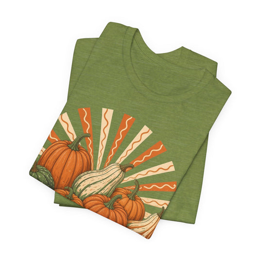 Heather green tee folded, orange gourd Gourd Vibes Only front print.