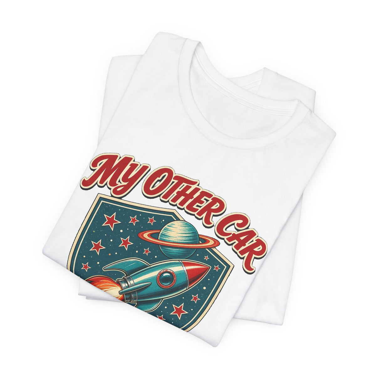 White crewneck t-shirts stacked with colorful rocket graphic