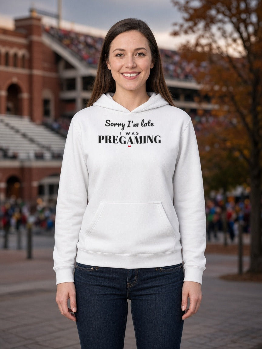 White hoodie on model with hood drawstrings and front text: 'Sorry I'm late was PREGAMING'.