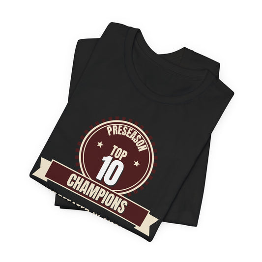 Black crewneck tee folded stack, featuring Preseason Top 10 Champions badge graphic.
