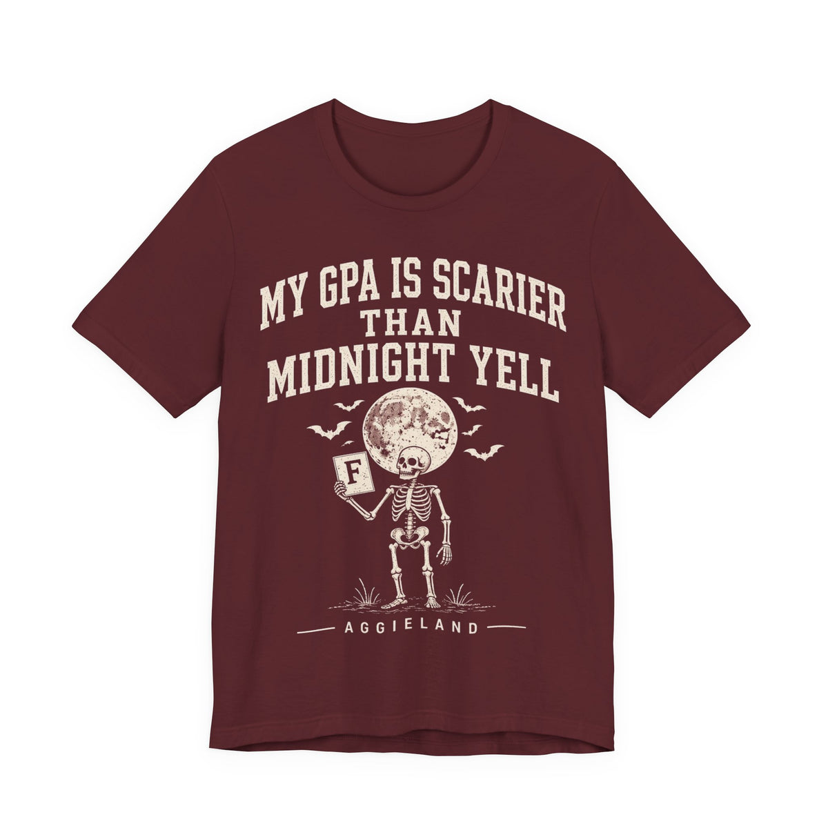 Maroon graphic T-shirt with text “My GPA is scarier than midnight yell” and mascot print