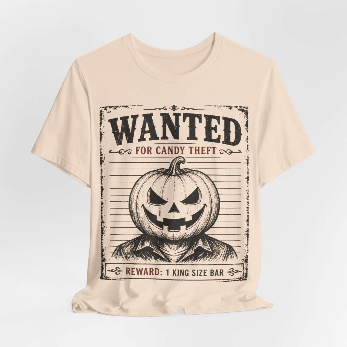 Soft cream T-shirt featuring black “WANTED” jack-o-lantern front graphic