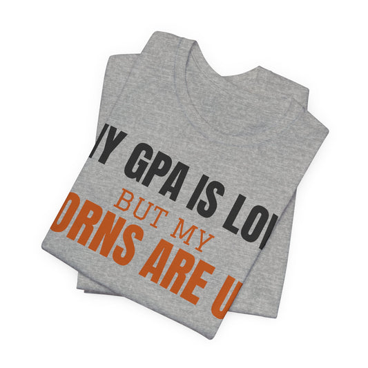 Heather gray folded graphic tee: "My GPA is low" and "horns are up".