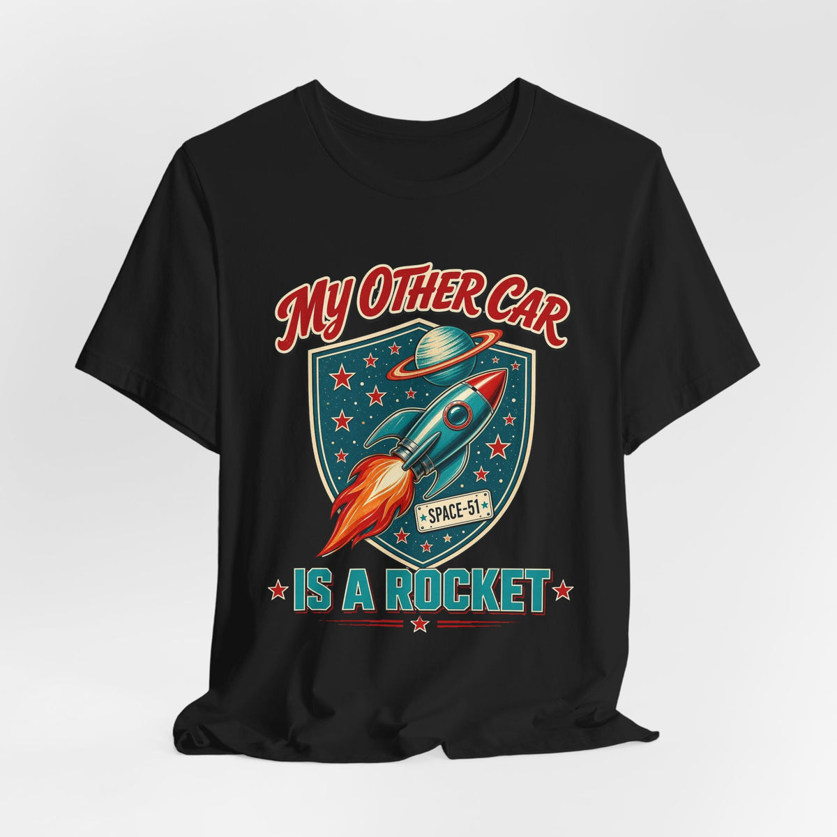 Black crewneck t-shirt front with colorful rocket and stars graphic