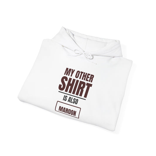 White hoodie with hood and drawstrings, front logo text with maroon 'Maroon' label