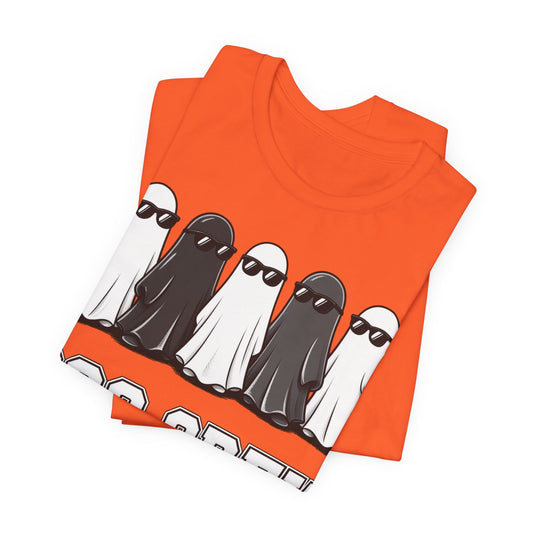 Orange crew neck T-shirt folded flat, showing gnome lineup graphic