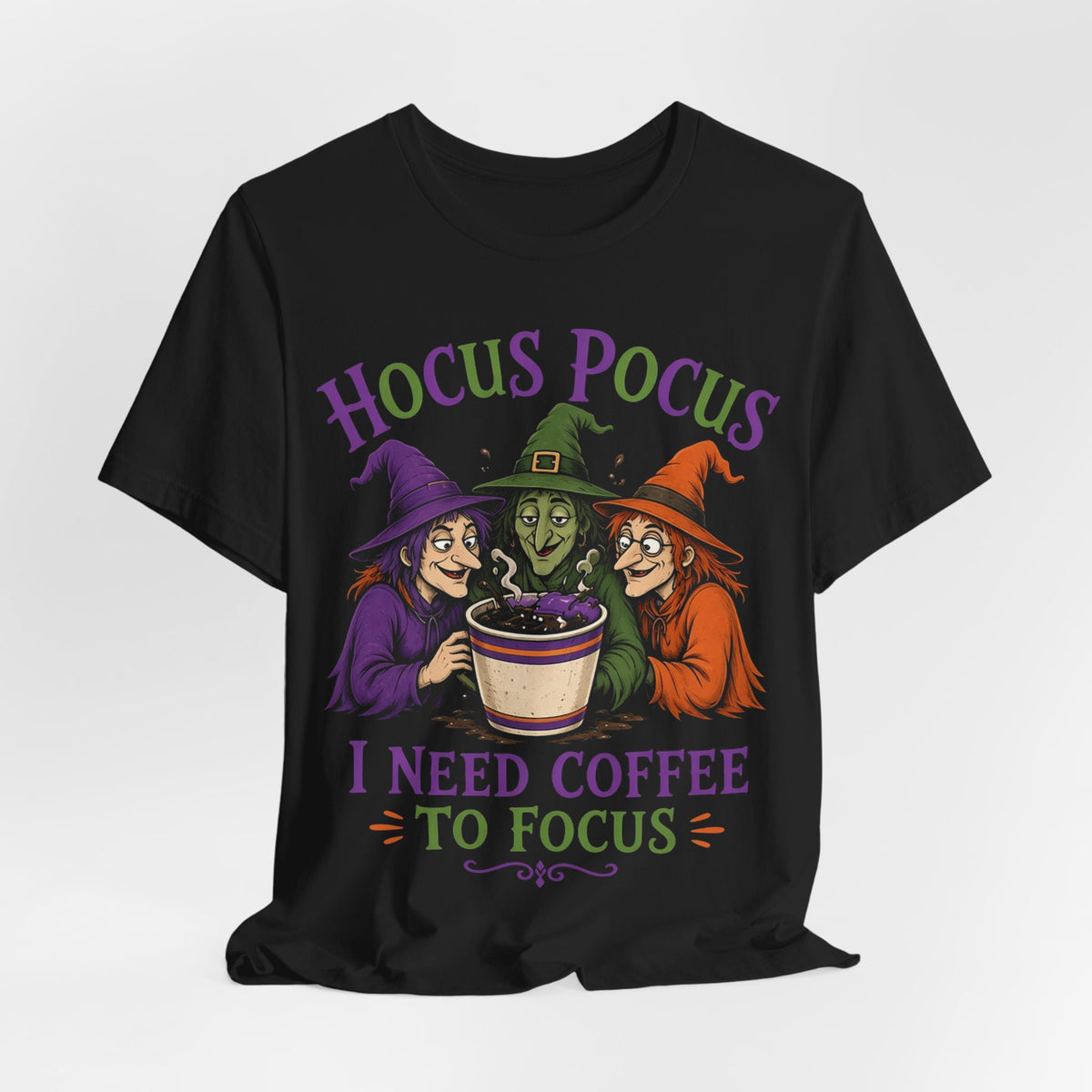 Black crewneck tee with 'Hocus Pocus' headline, witches, and 'I need coffee to focus'