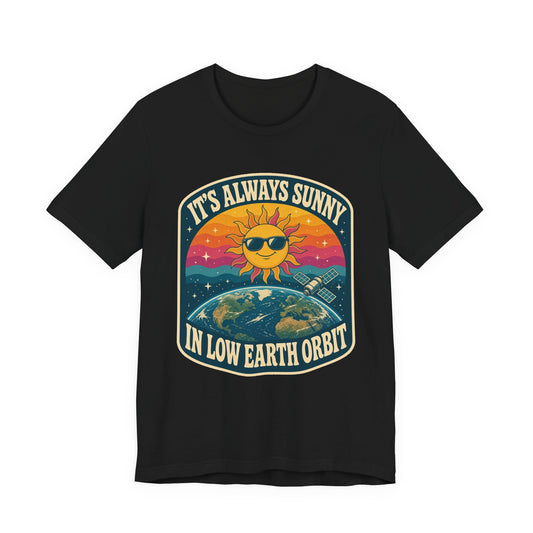 Black crewneck T-shirt with colorful “It’s Always Sunny in Low Earth Orbit” graphic print.