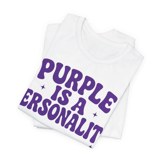 Folded white T-shirt with purple 'Purple Is a Personality' print