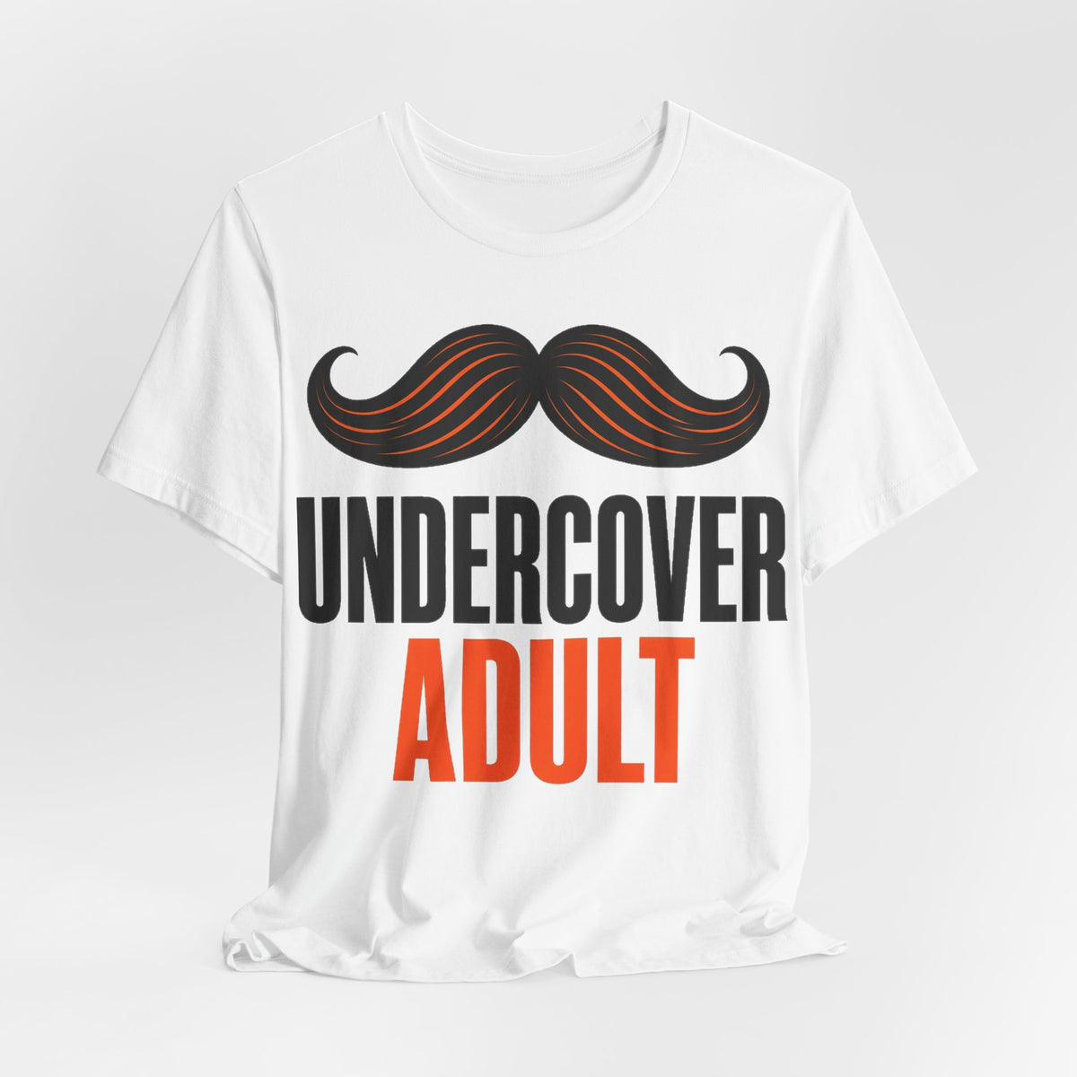 White adult graphic t-shirt with centered mustache art and 'UNDERCOVER ADULT' lettering