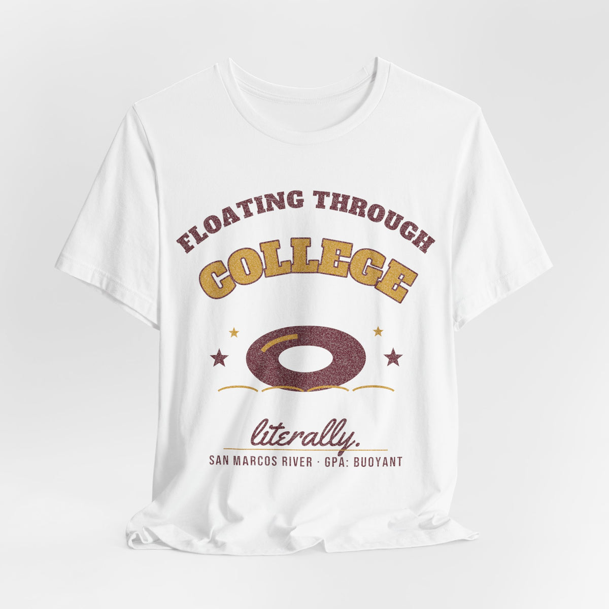 White T-shirt with “Floating Through College” lettering, donut-ring icon, and “literally” line