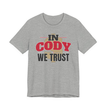 Athletic heather gray graphic T-shirt with large 'IN CODY' and 'WE TRUST' text