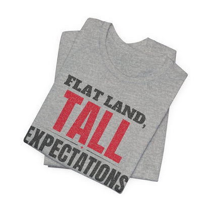 Heather gray graphic T-shirt with 'FLAT LAND, TALL EXPECTATIONS' front lettering