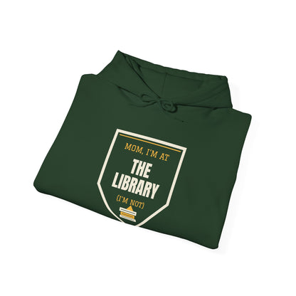 Forest green hoodie folded with 'Mom, I'm at the Library' graphic print