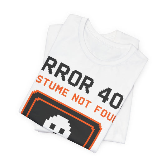 White folded tee showing 'ERROR 404' pixel graphic and 'COSTUME NOT FOUND' text