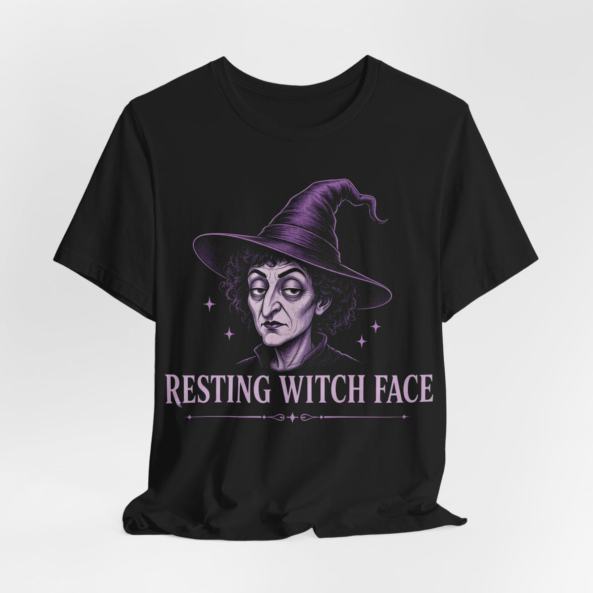 Black crewneck T-shirt with centered purple witch face wearing wide-brim hat