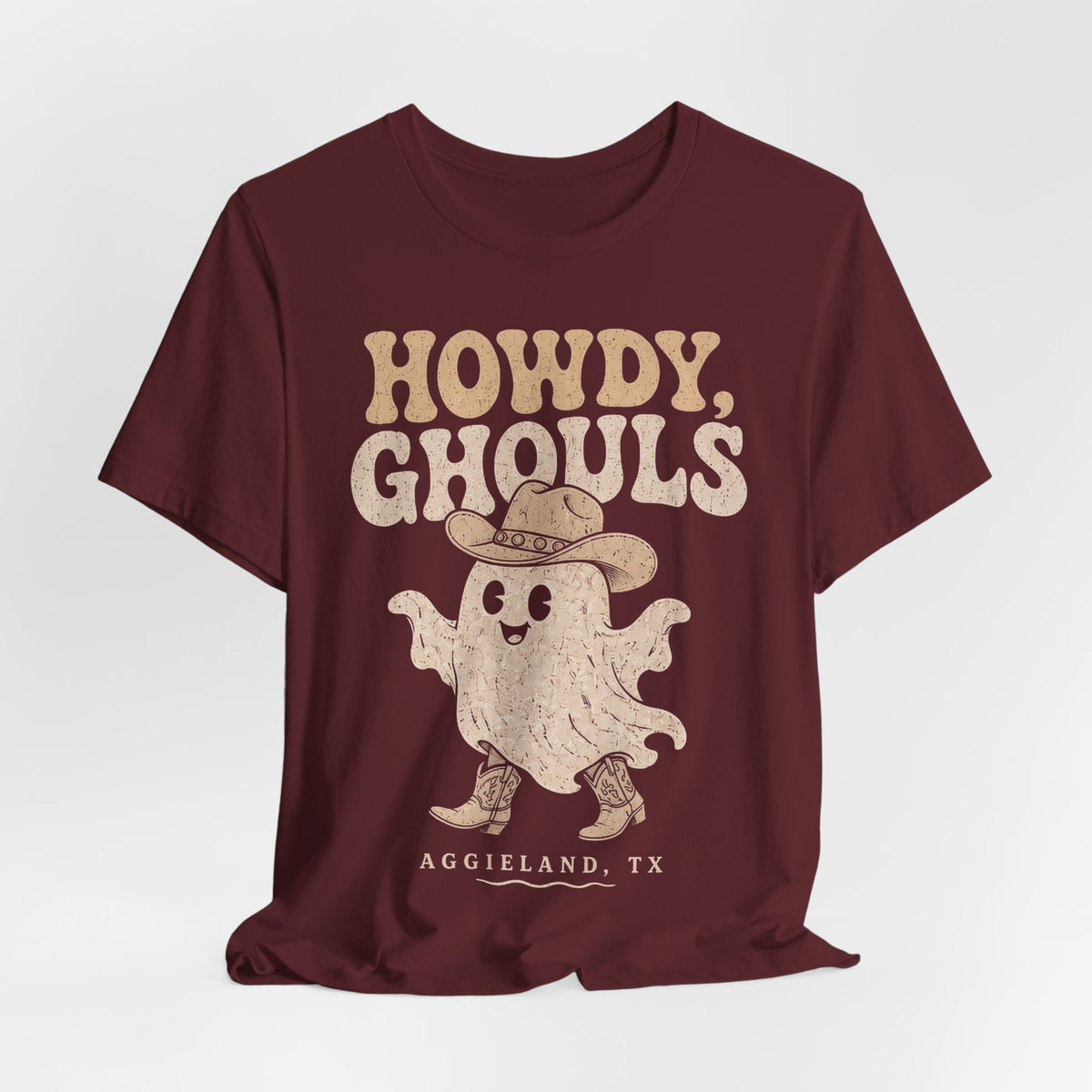 Maroon t-shirt with Howdy Ghouls ghost graphic and Aggieland TX print