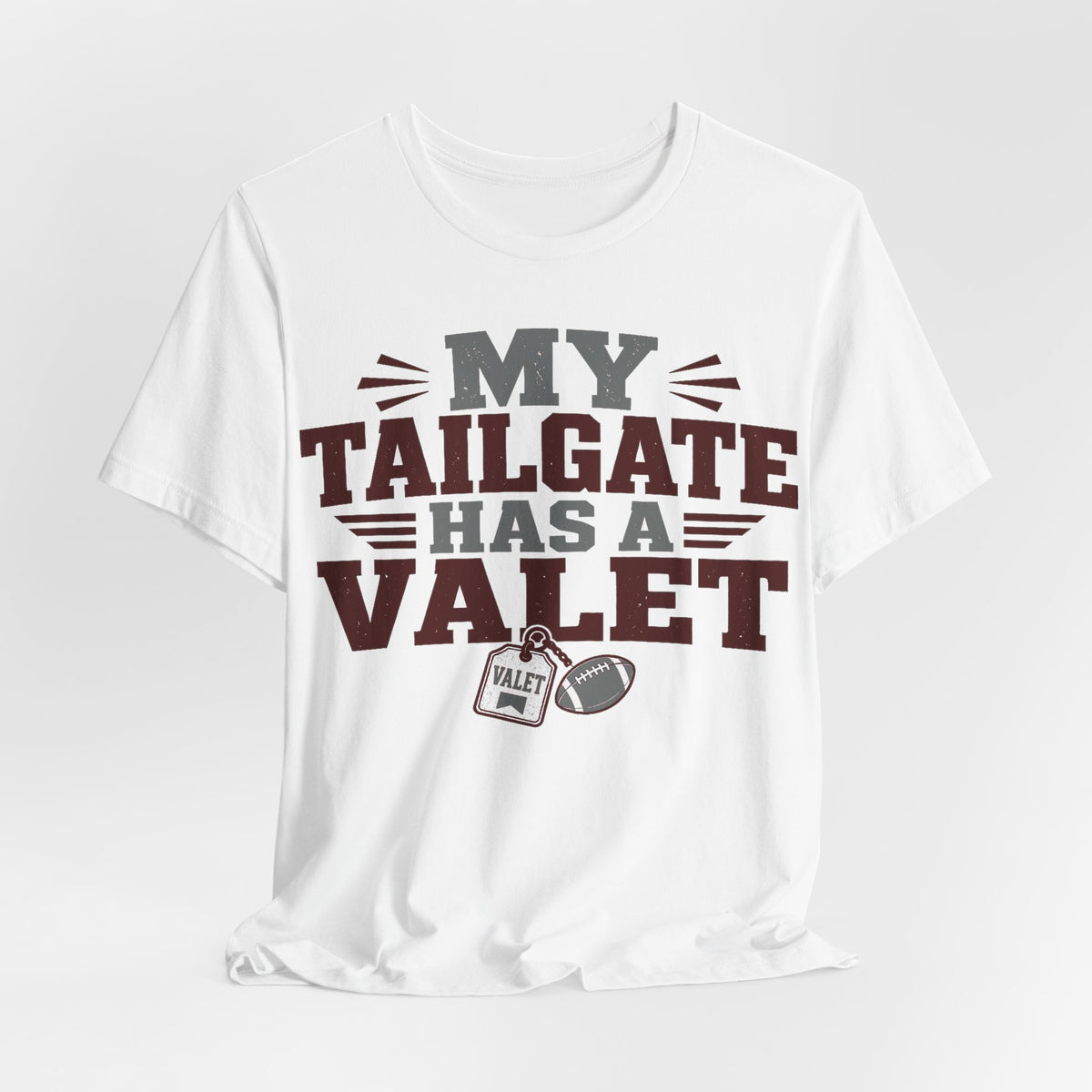 White graphic T-shirt with large 'MY TAILGATE HAS A VALET' text and small valet patch