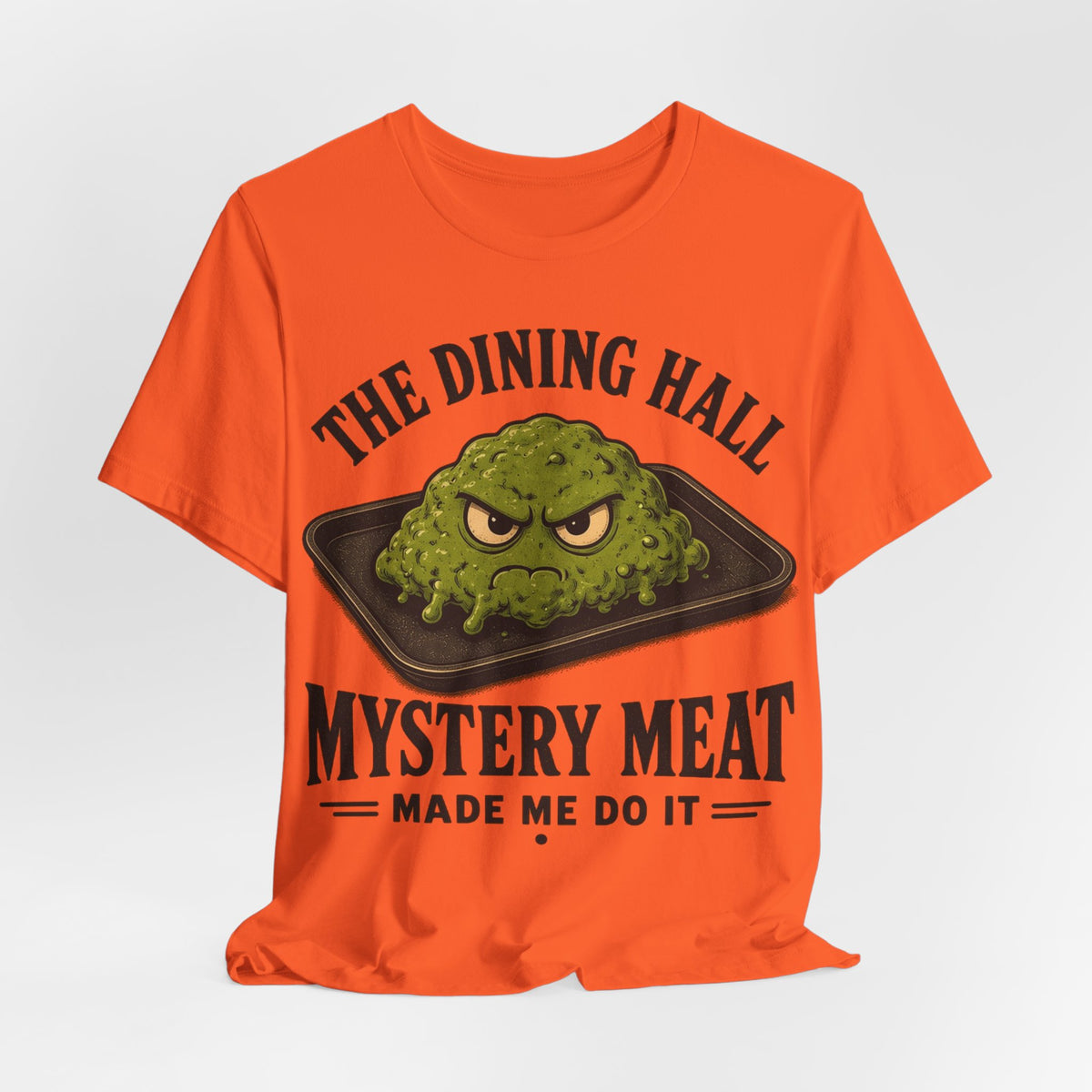 Orange crewneck tee with green food graphic and 'Mystery Meat' 'made me do it'