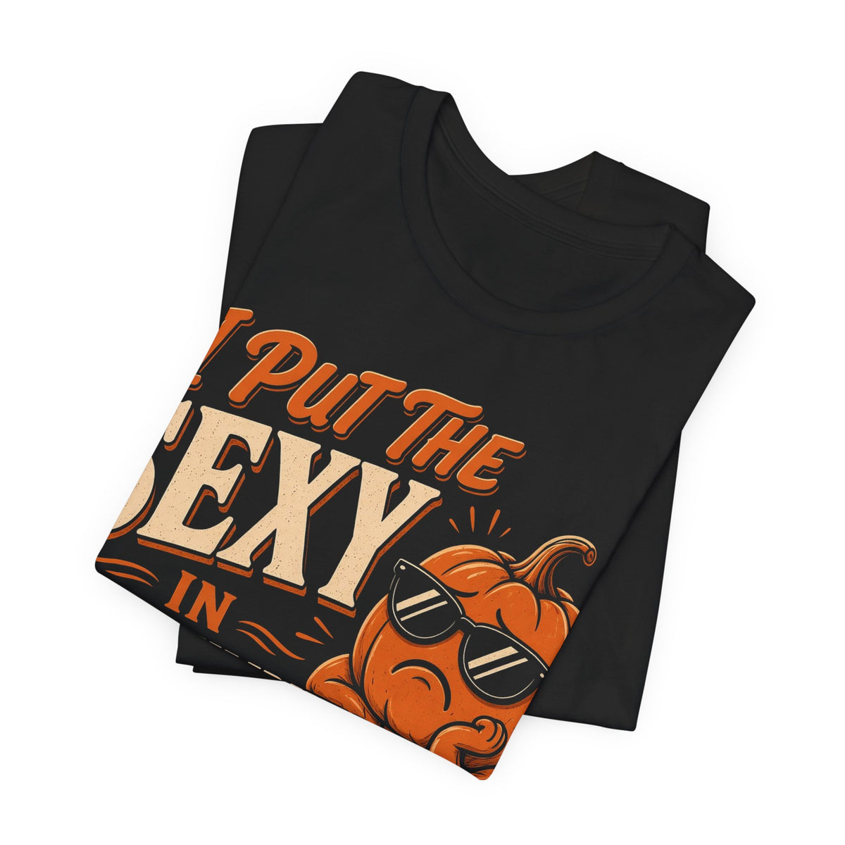 Black crewneck T-shirt folded view with orange pumpkin graphic and sunglasses text