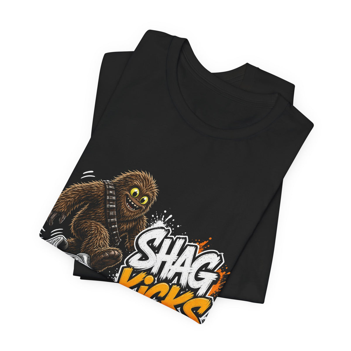 Black T-shirt stack angled, cartoon creature and silver wave graphic with orange lettering