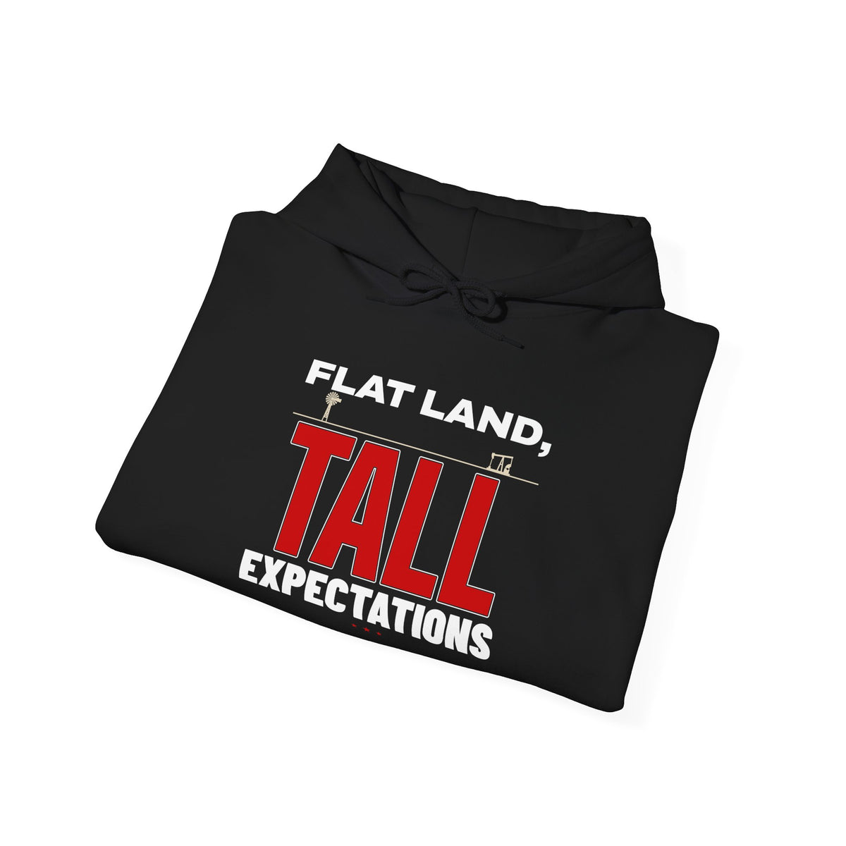 Folded black hoodie with “FLAT LAND, TALL EXPECTATIONS” front graphic and drawstring hood