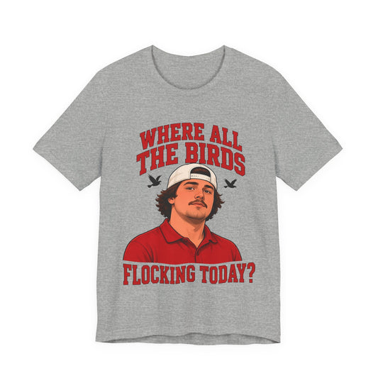 Athletic heather gray graphic crewneck tee with illustrated man and red 'WHERE ALL THE BIRDS' text.
