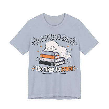 Light blue ghost graphic T-shirt with stacked books and smiley face print