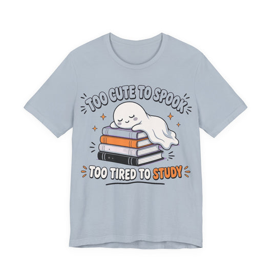 Light blue ghost graphic T-shirt with stacked books and smiley face print