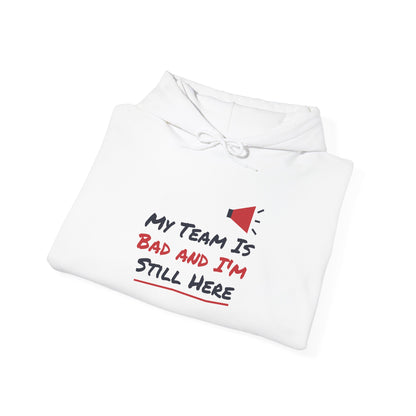 White hoodie with front graphic text: “My Team Is Bad and I’m Still Here”