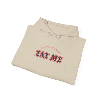 Sand-colored hoodie with “EAT ME” graphic logo and front drawstring hood