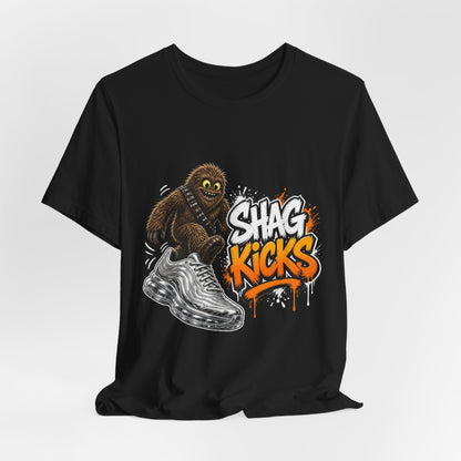 Black graphic T-shirt, front view, cartoon creature and silver wave with orange/white text
