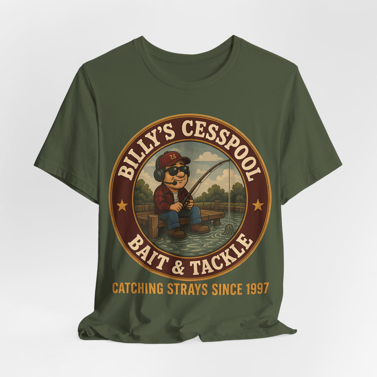 Military green crewneck tee with circular bait & tackle graphic and “Catching Strays Since 1997”