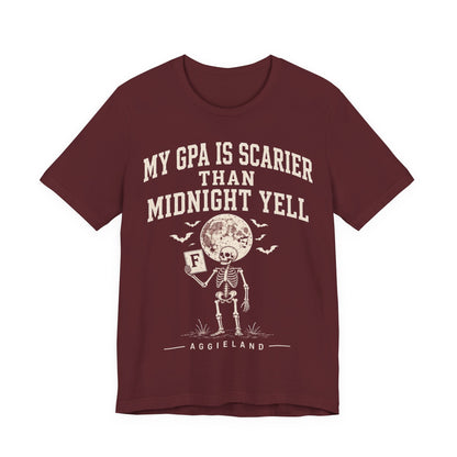 Maroon graphic T-shirt with text “My GPA is scarier than midnight yell” and mascot print