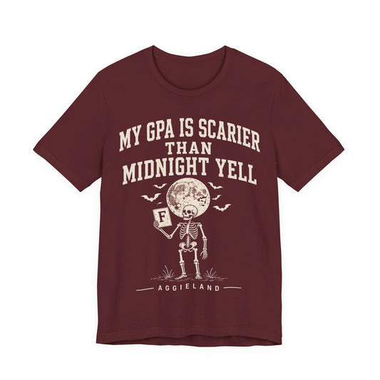 Maroon graphic T-shirt with text “My GPA is scarier than midnight yell” and mascot print