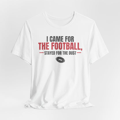 White crewneck football graphic t-shirt with red “stayed for the dust” lettering