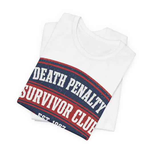Folded white crewneck T-shirt with 'Death Penalty Survivor Club' band graphic
