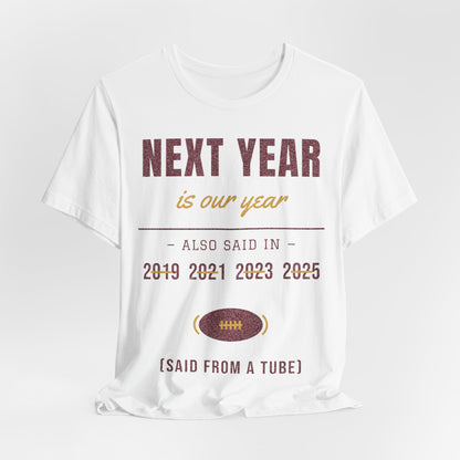 White graphic T-shirt with 'NEXT YEAR is our year' message and football emblem