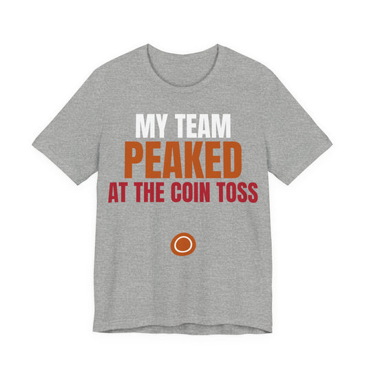 Heather gray graphic tee: 'MY TEAM PEAKED AT THE COIN TOSS' with coin icon