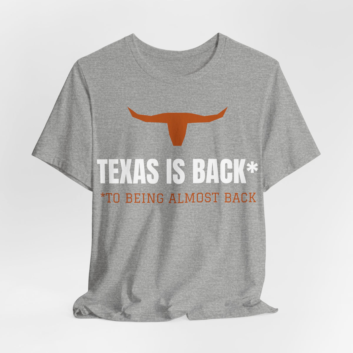 Athletic heather Texas Is Back* tee with orange longhorn and 'to being almost back' line