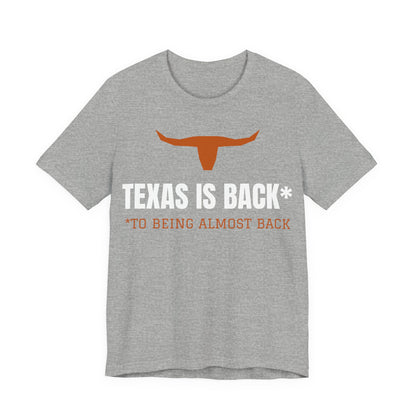 Athletic heather Texas Is Back* tee with orange longhorn and text graphic