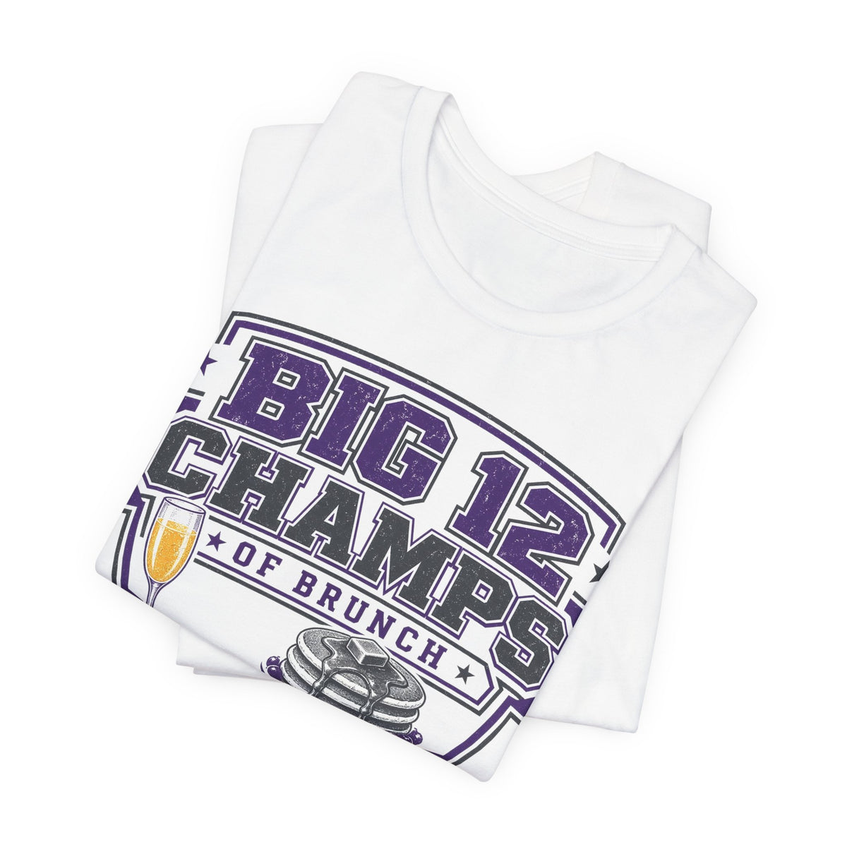 Stacked white T-shirts showing BIG 12 CHAMPS OF BRUNCH print with trophy and steins