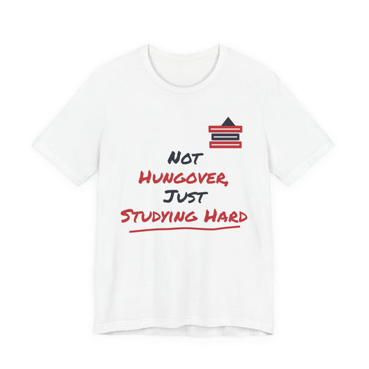 White graphic T-shirt with “Not hungover, just studying hard” and books icon.