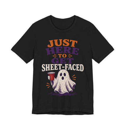 Black crew-neck tee with colorful "Just Here to Get Sheet-Faced" ghost graphic