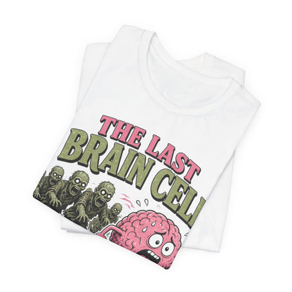 White crew-neck tee, folded, with colorful brain-cell and zombie robot graphic