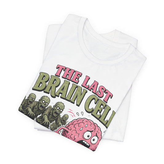 White crew-neck tee, folded, with colorful brain-cell and zombie robot graphic